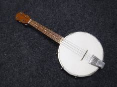 A circa 1960's banjo ukulele, with new vellum,