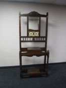 An Edwardian oak mirrored hall stand