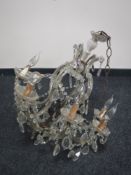 An early 20th century glass eight branch chandelier with drops