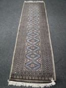 A fringed runner of geometric design