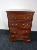 A mahogany Regency style four drawer chest on bracket feet
