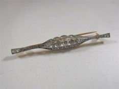 An 18ct gold diamond set bar brooch