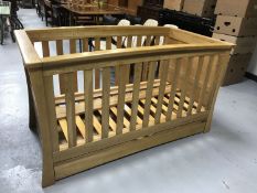 A Mamas & Papas cot bed fitted with a drawer