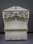 A white painted kitchen wall shelf,