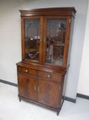 A Regency style inlaid mahogany bookcase,