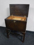 A glazed door wall cabinet and a mid 20th century oak sewing box