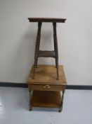 An oak two tier occasional table on turned legs and an oak two tier side table,