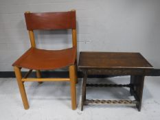 An early twentieth century carved oak stool with barley twist supports,