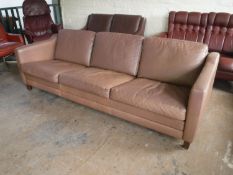 A twentieth century brown leather three seater settee