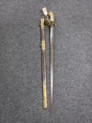 A 19th century naval officer's sword in leather scabbard
