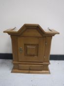 A 20th century oak wall cabinet fitted a drawer