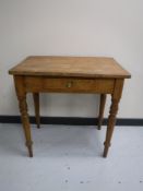 An antique pine kitchen work table fitted a drawer