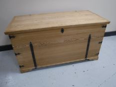 A stripped pine blanket chest