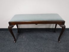 A mahogany duet stool on cabriole legs