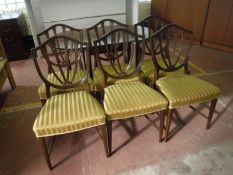 A set of six shield back dining chairs