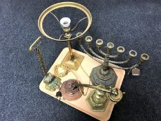 A tray of brass seven branch menorah, lion paw door stop,