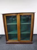 An Edwardian mahogany sliding door bookcase