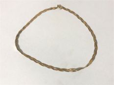 An Italian three-tone necklace stamped 9k CONDITION REPORT: 7.