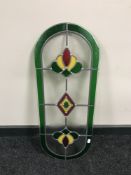 An un-framed leaded glass window