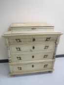 A late 19th century hand painted four drawer chest on bun feet