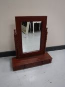 A dressing table mirror