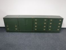 A four section low sideboard with brass handles fitted cupboards and drawers
