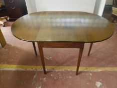 A twentieth century walnut drop leaf table