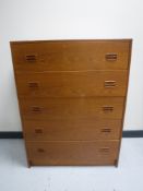 A mid 20th century teak five drawer chest
