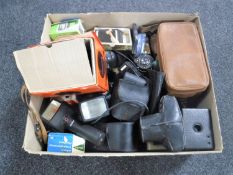 A box of various cameras and accessories
