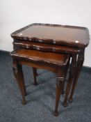 A nest of three Chapmans Siesta pie crust edge tables