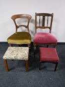 Two Victorian dining chairs and two upholstered footstools