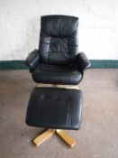 A black leather swivel relaxer chair,