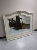 A large Victorian style arch topped overmantel mirror