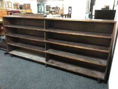 A large set of mid 20th century stained beech shelves