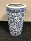 A blue and white oriental style porcelain stick stand