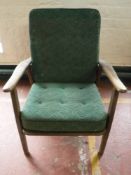 A mid twentieth century teak framed armchair