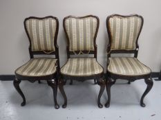 A set of three antique mahogany dining chairs