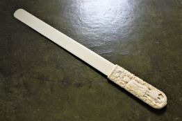 A 19th century German carved ivory page turner,