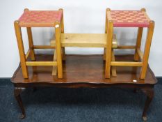A shaped walnut coffee table,