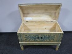 A pine domed topped trunk on stand