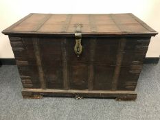 A Spanish nineteenth century walnut metal bound coffer, width 91 cm.
