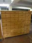 A pine twenty eight drawer chest