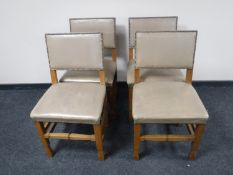 Four oak leather upholstered dining chairs