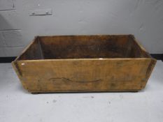 An antique rustic pine trough