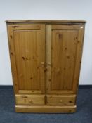 A pine double door TV cabinet