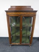 A Victorian inlaid mahogany double door display cabinet