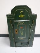 A hand painted antique oak wall cabinet