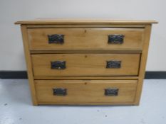 An Edwardian satin walnut three drawer chest