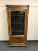 A Continental glazed walnut display cabinet,