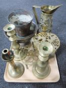 A tray of brass and copper including embossed jugs, trivet,